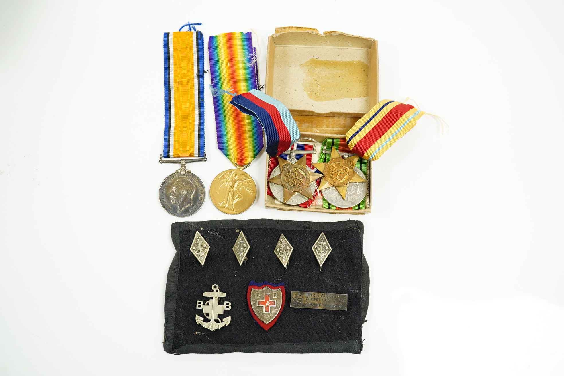 Twelve medals including; a First World War pair to Pte. C.F. Humphreys R. Sussex Reg., and three WWII medal groups, two in original card issue boxes and including the Burma star, the Africa star, etc. plus a few other it